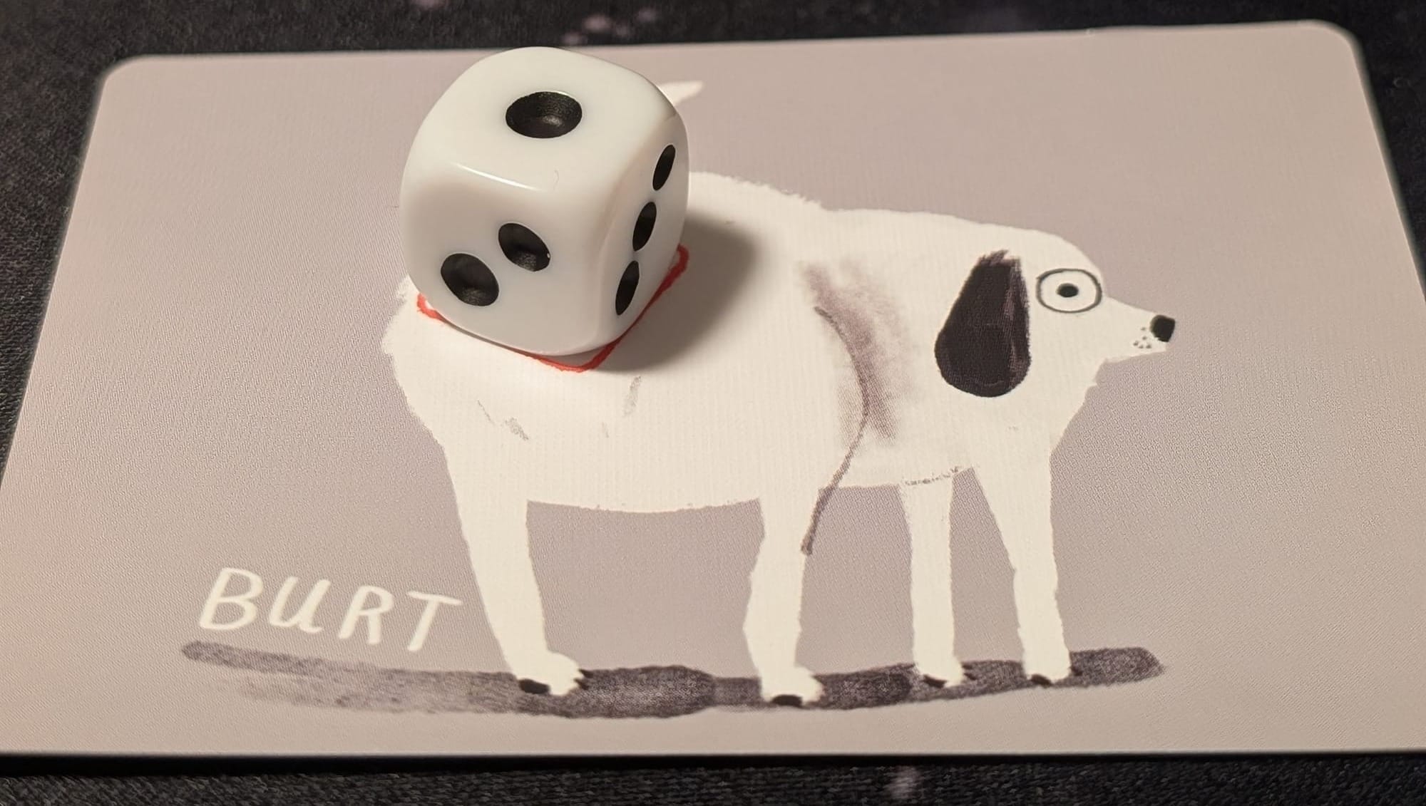 Cartoon picture of a dog named Bert. There is a dye showing the number one on the dogs butt.